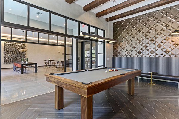 Clubhouse featuring modern interiors and communal seating at Ventura Pointe Apartments