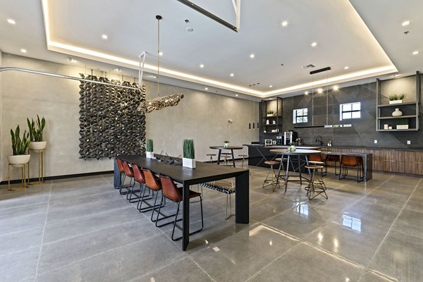 Clubhouse with modern design and comfortable seating at Ventura Pointe Apartments, luxury living in a vibrant community setting
