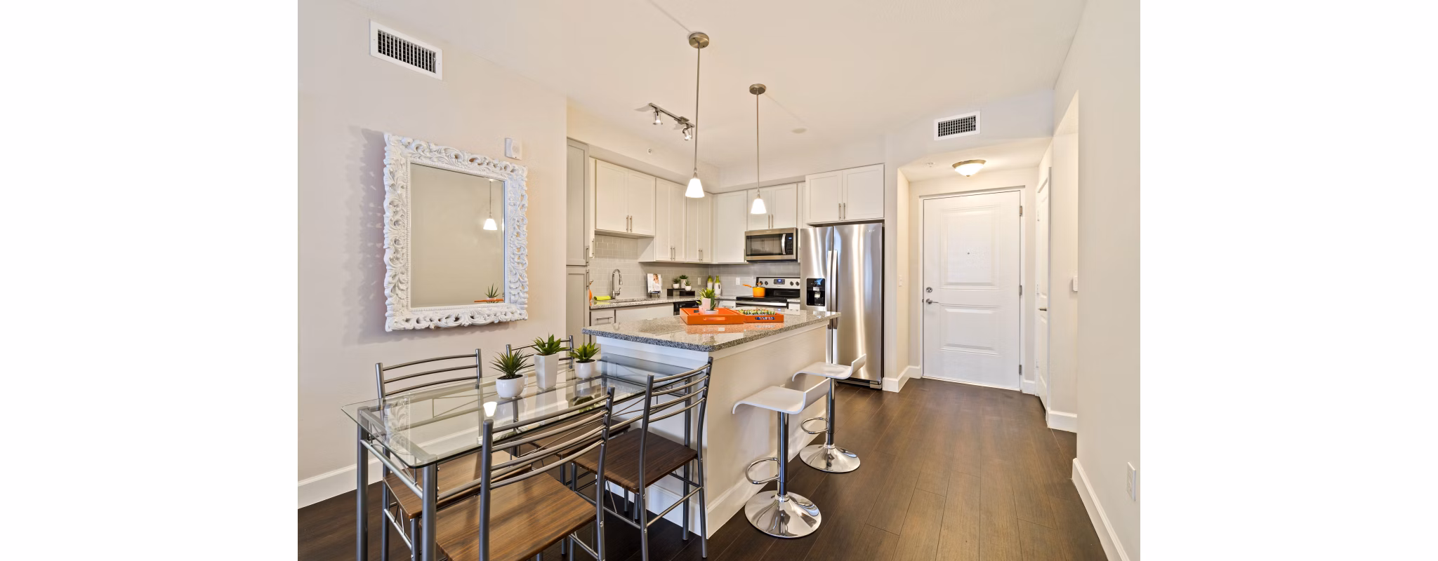 Modern kitchen featuring stainless steel appliances at Ventura Pointe Apartments