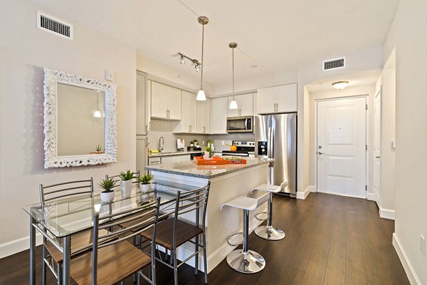 Modern kitchen featuring stainless steel appliances at Ventura Pointe Apartments