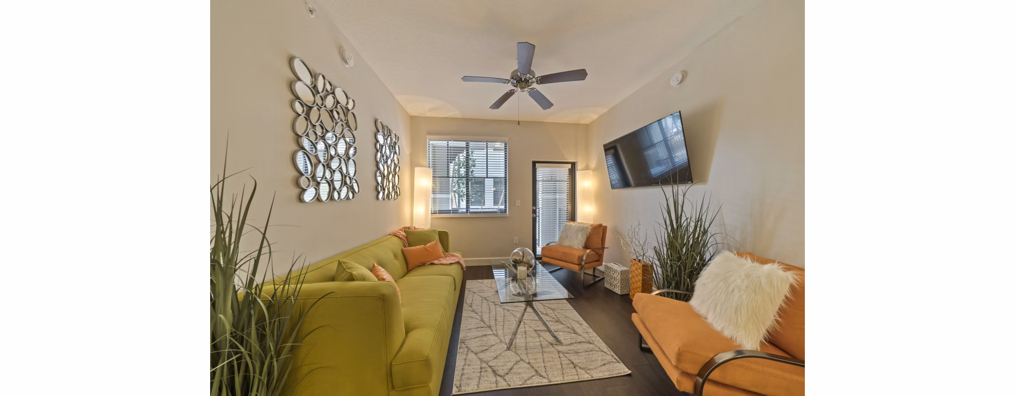 Spacious living room with modern furnishings in Ventura Pointe Apartments