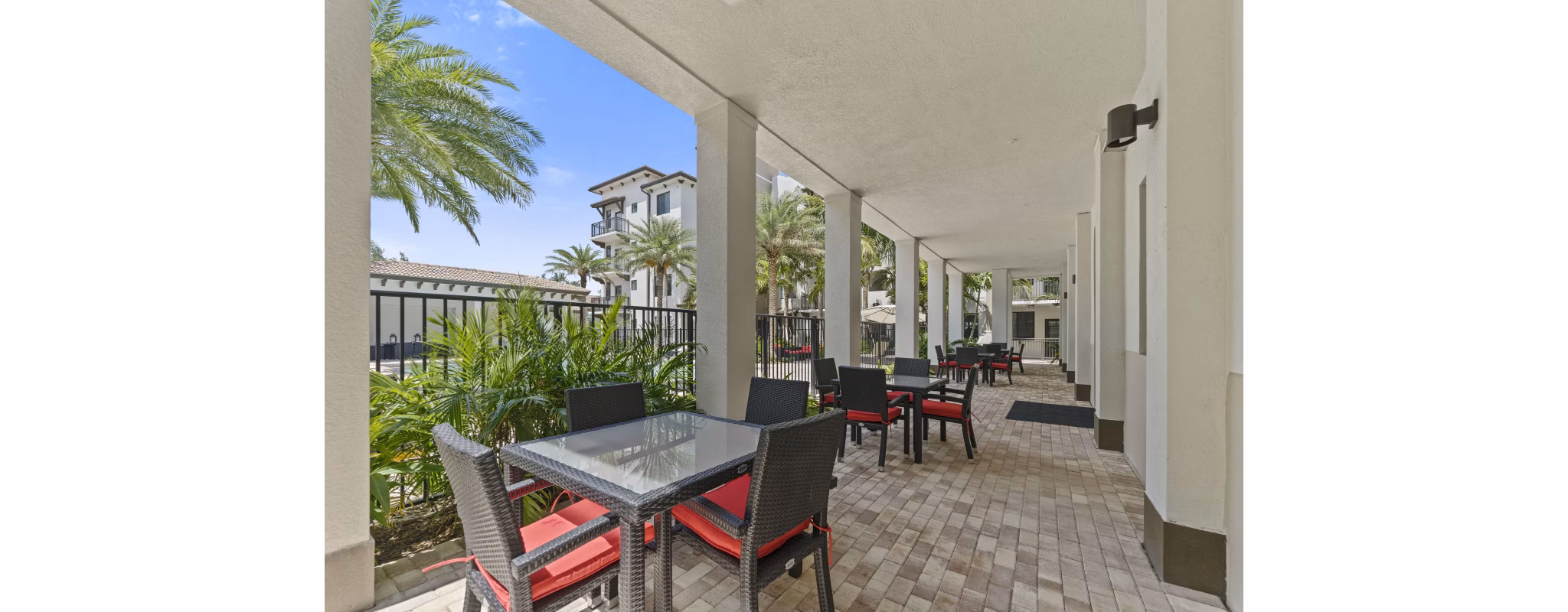 Cozy outdoor patio with seating at Ventura Pointe Apartments