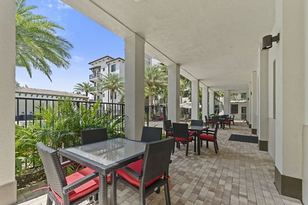Cozy outdoor patio with seating at Ventura Pointe Apartments