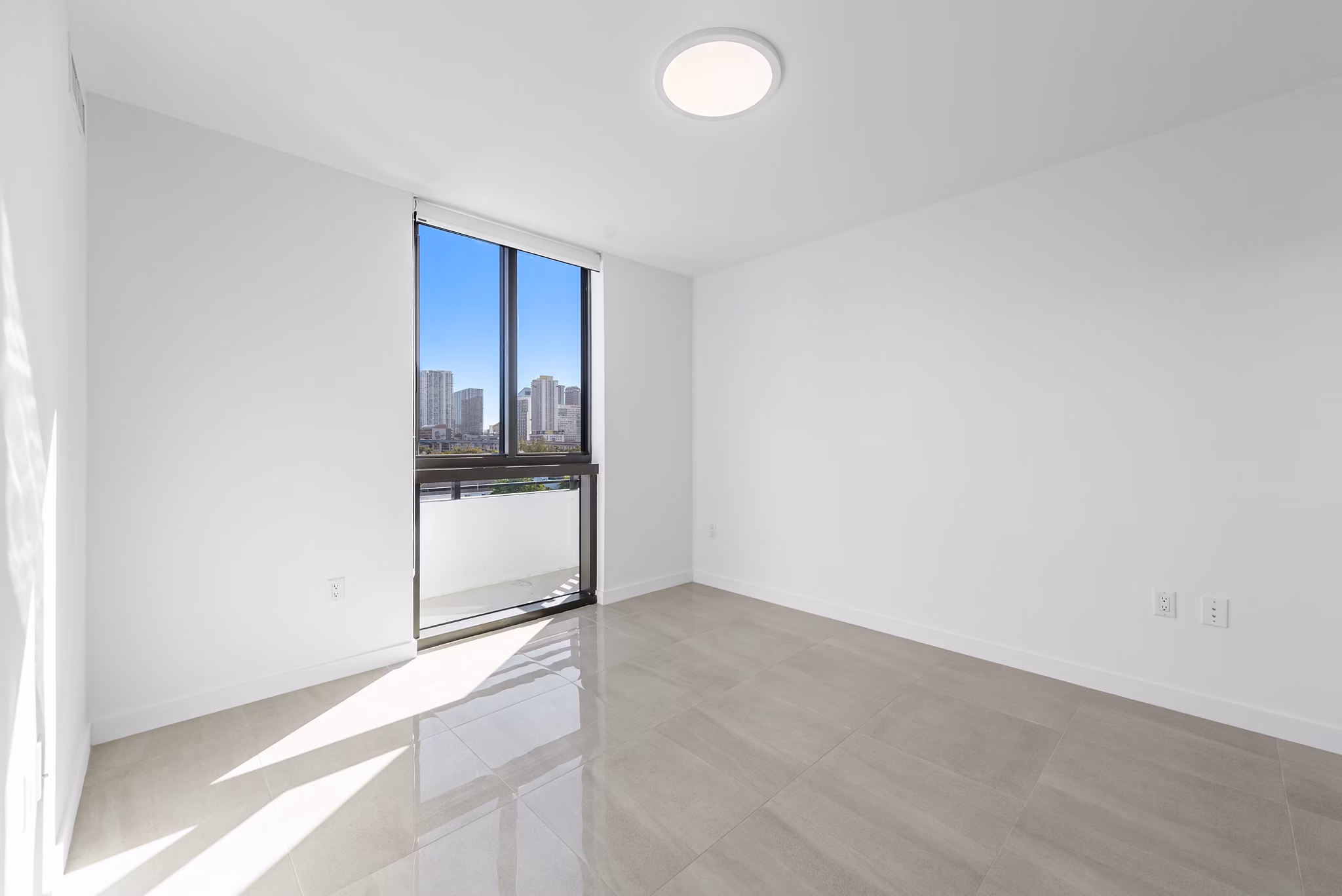 Bedroom featuring modern decor and plush bedding at The Vibe Miami Apartments