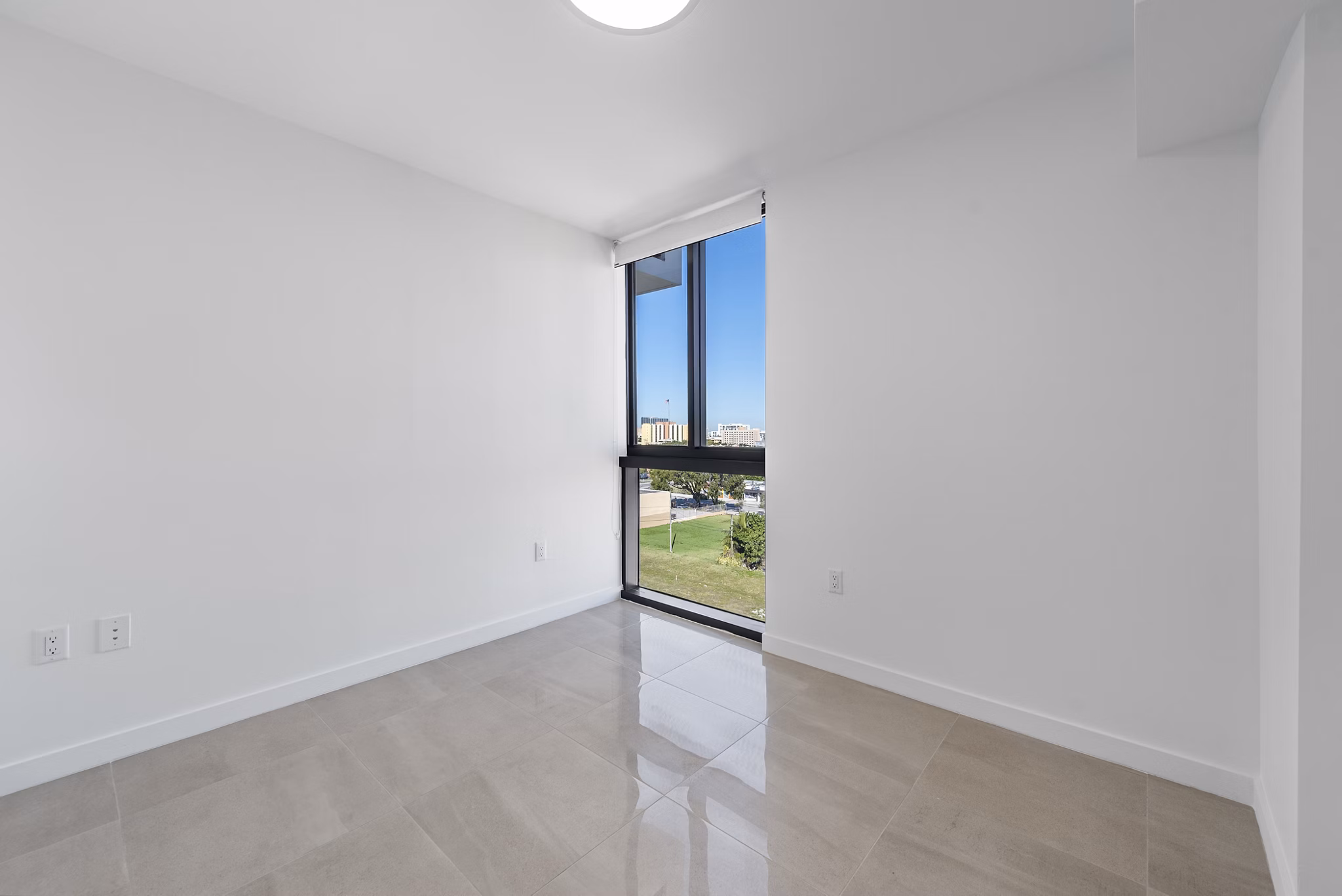 Cozy bedroom with modern decor at The Vibe Miami Apartments