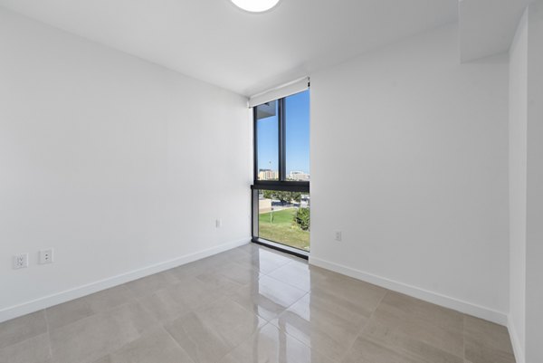 Cozy bedroom with modern decor at The Vibe Miami Apartments