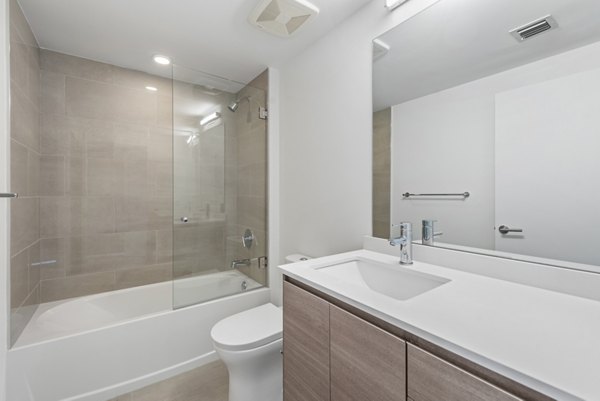 The Vibe Miami Apartments: Modern bathroom with sleek fixtures and ample lighting