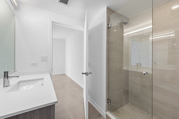 Modern bathroom with sleek fixtures at The Vibe Miami Apartments