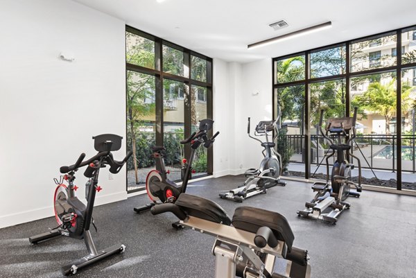 Spacious fitness center with modern equipment at The Vibe Miami Apartments