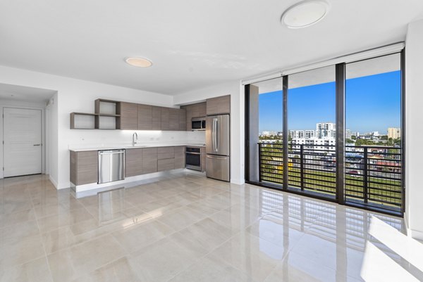 Spacious living room with chic decor and natural light in The Vibe Miami Apartments