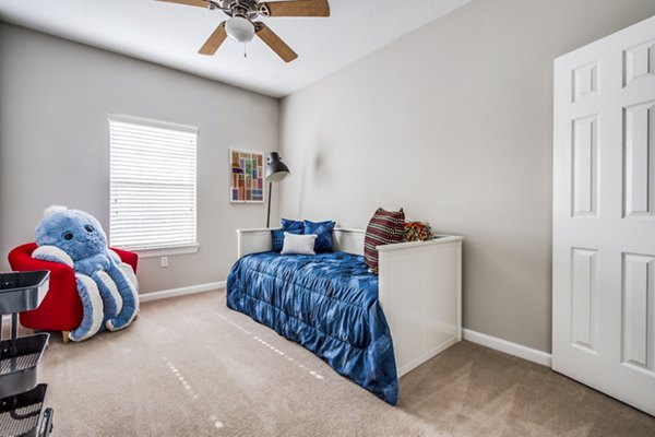 Bedroom with modern decor and cozy atmosphere at Addicks Stone Village Apartments