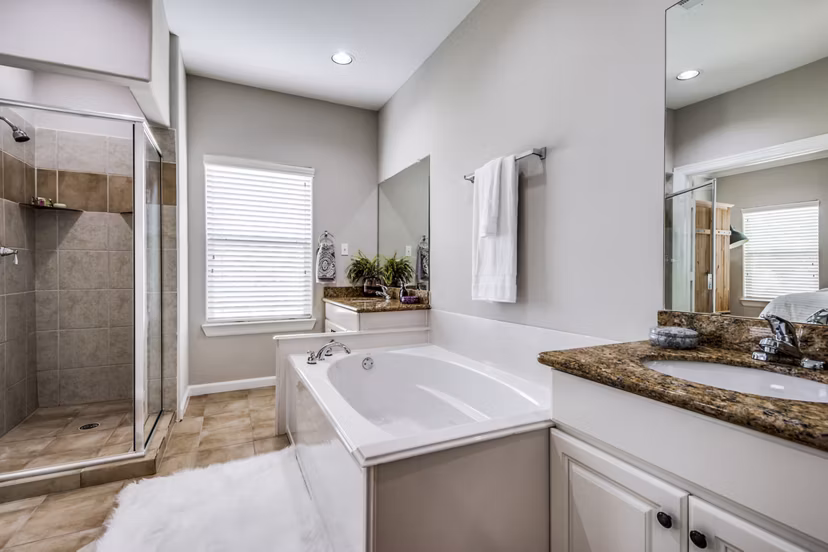 Bathroom featuring modern fixtures and sleek design at Addicks Stone Village Apartments