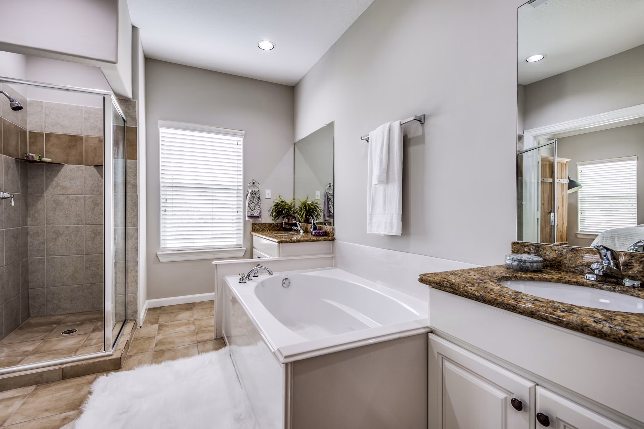 Bathroom featuring modern fixtures and sleek design at Addicks Stone Village Apartments