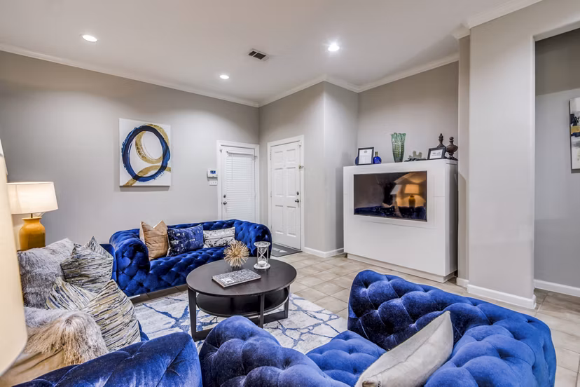 Lobby area featuring contemporary design and plush seating at Addicks Stone Village Apartments