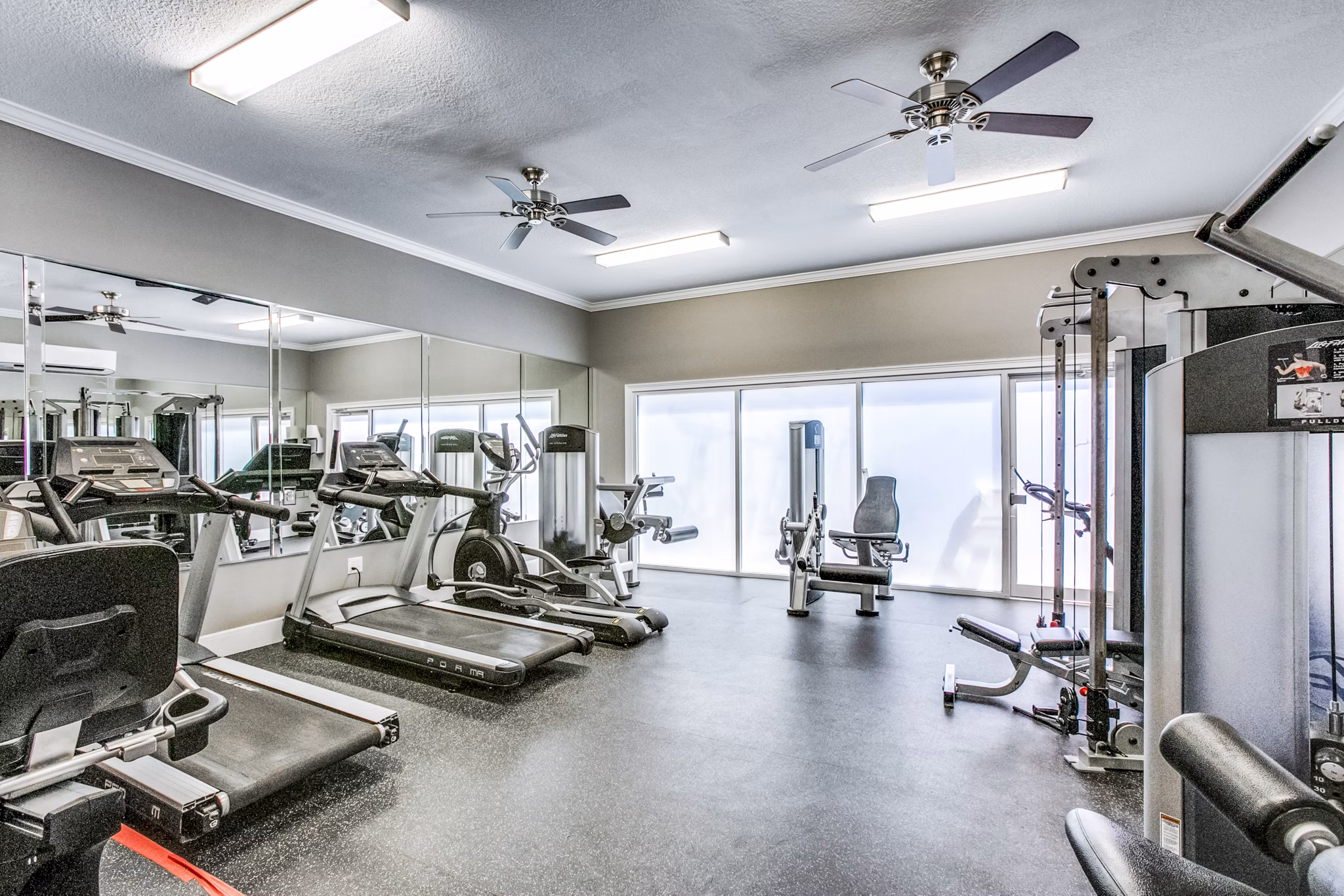 State-of-the-art fitness center with modern equipment at Addicks Stone Village Apartments