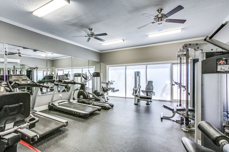 State-of-the-art fitness center with modern equipment at Addicks Stone Village Apartments