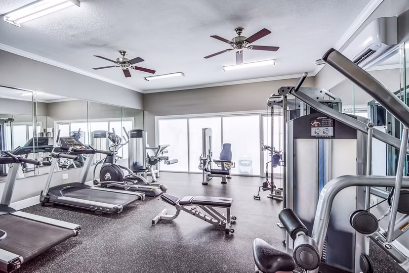 State-of-the-art fitness center with modern equipment at Addicks Stone Village Apartments
