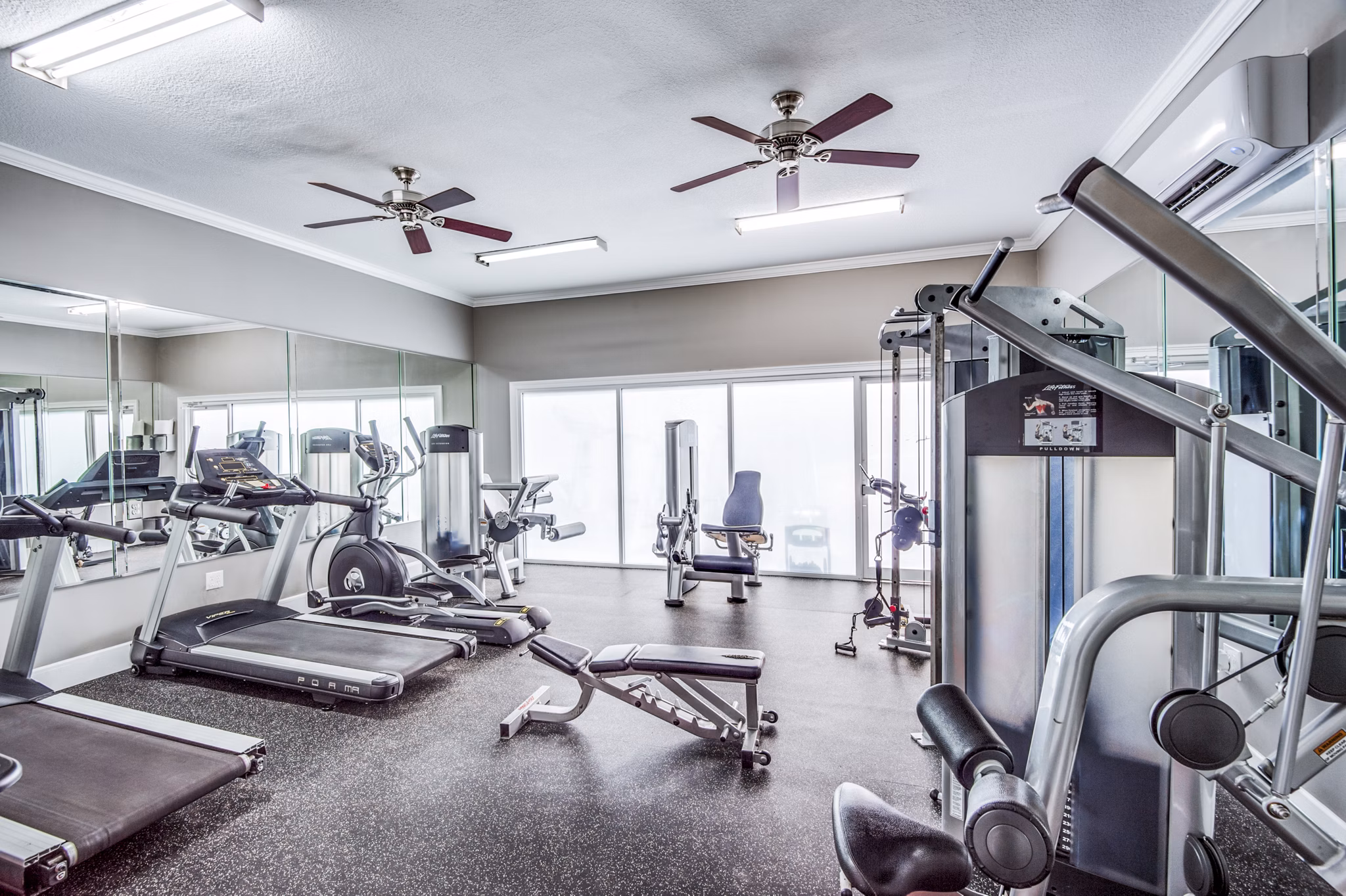 State-of-the-art fitness center with modern equipment at Addicks Stone Village Apartments