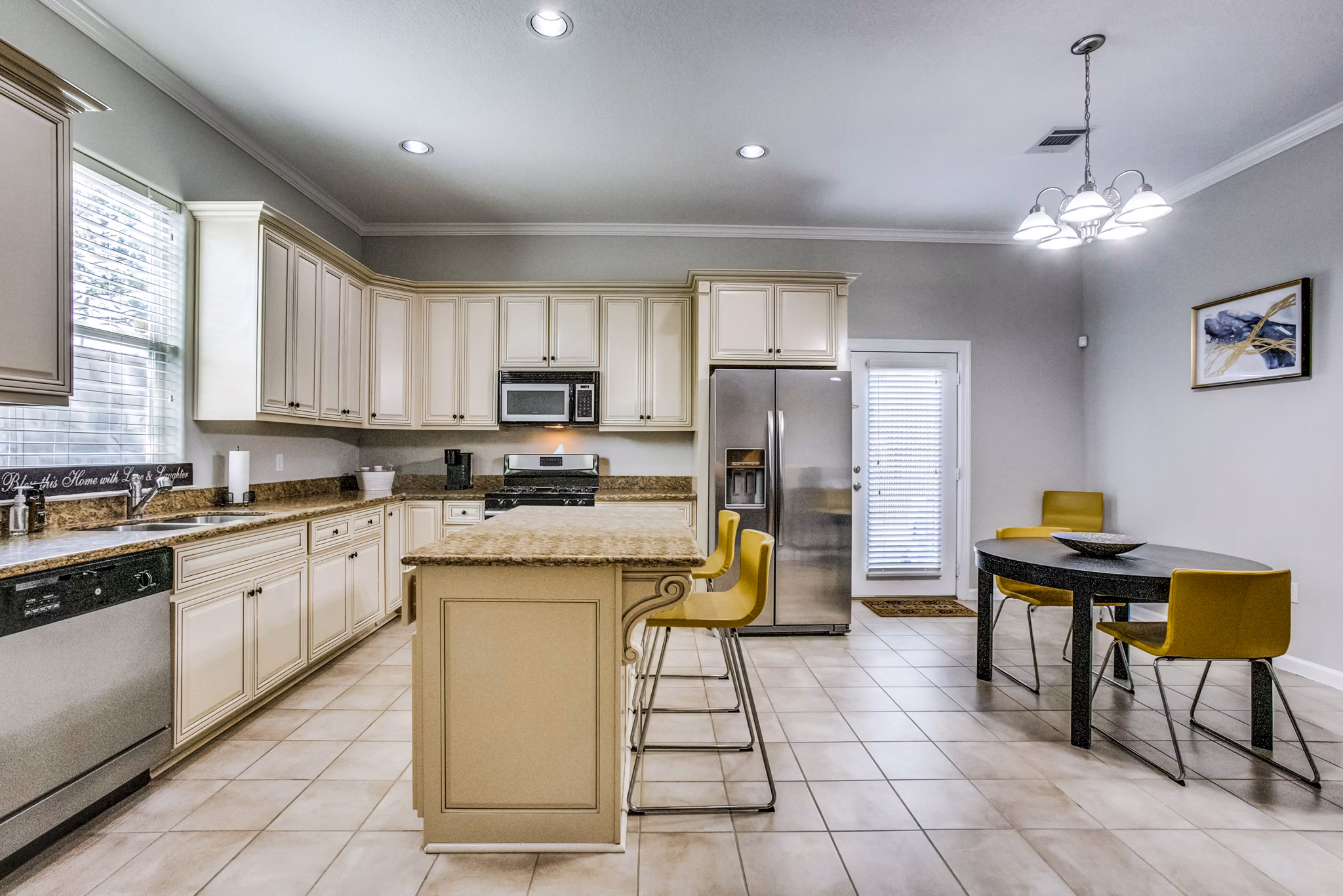 Modern kitchen with stainless steel appliances at Addicks Stone Village Apartments, a luxury community offering upscale living spaces
