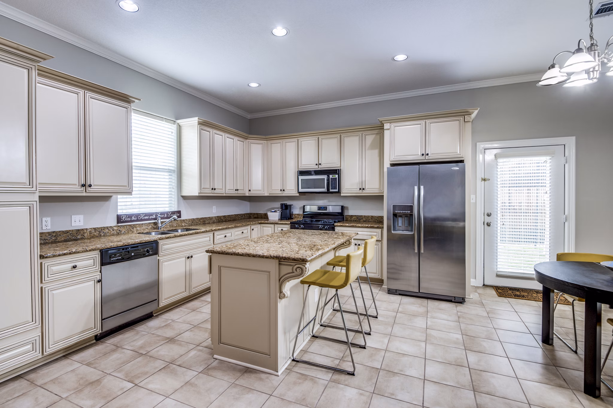 Modern kitchen with stainless steel appliances in Addicks Stone Village Apartments