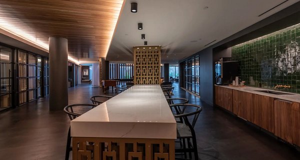 Clubhouse with modern decor and seating areas at Bayou on the Bend Apartments