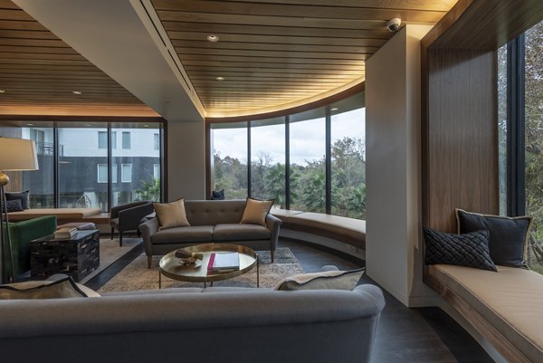 Lobby with stylish seating and modern decor at Bayou on the Bend Apartments in Houston