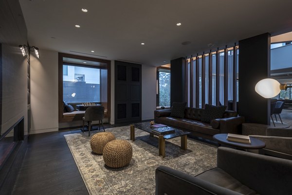 Elegant lobby with modern seating and art decor at Bayou on the Bend Apartments