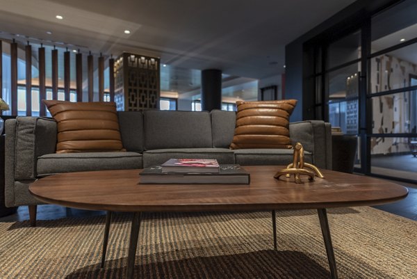 Clubhouse featuring modern design and plush seating at Bayou on the Bend Apartments