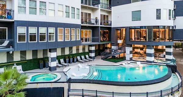 Resort-style pool at Bayou on the Bend Apartments offering luxurious relaxation and leisure activities in a serene setting