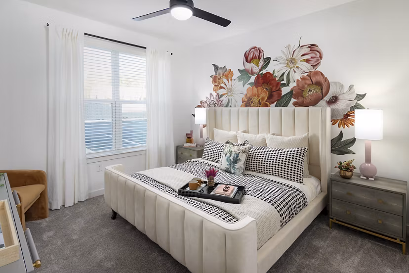 Bedroom with modern furnishings and neutral tones at Marlowe South Fulton Apartments, luxury residence by Greystar