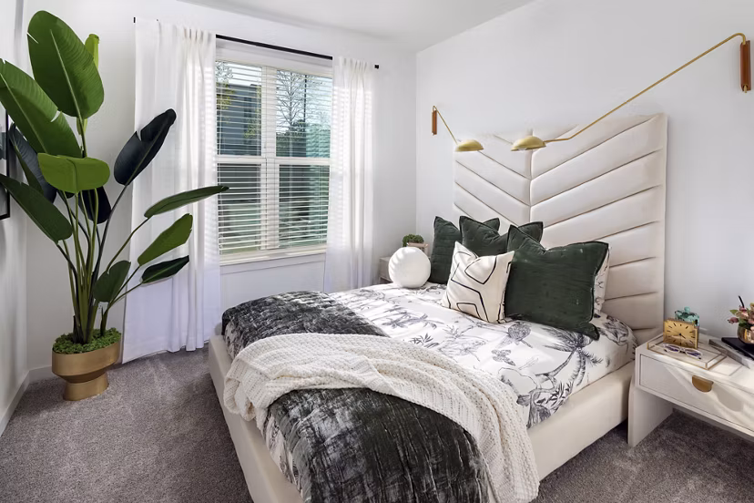 Cozy bedroom with modern decor at Marlowe South Fulton Apartments, offering luxury living spaces near Atlanta