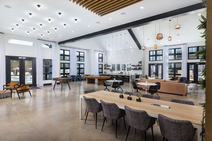 Clubhouse with modern design and comfortable seating at Marlowe South Fulton Apartments