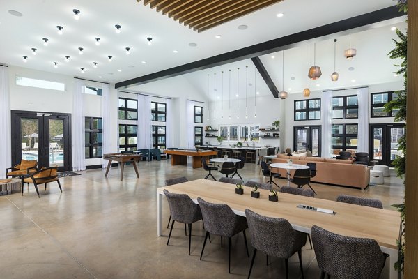 Clubhouse with modern design and comfortable seating at Marlowe South Fulton Apartments