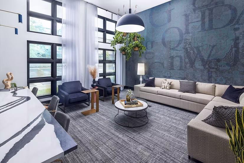 Modern clubhouse with cozy seating and fireplace at Marlowe South Fulton Apartments, ideal for gatherings and relaxation