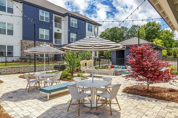 Chic outdoor patio with cozy seating at Marlowe South Fulton Apartments