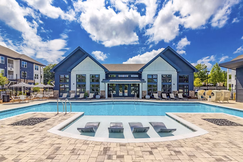 Stunning outdoor pool at Marlowe South Fulton Apartments with lounge seating and landscaping