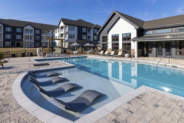 Resort-style pool with lounge chairs at Marlowe South Fulton Apartments, perfect for relaxation and leisure in a luxury setting