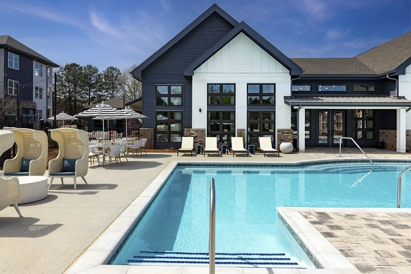 Resort-style pool with lounging areas at Marlowe South Fulton Apartments