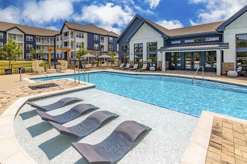 Luxury outdoor pool with lounge area at Marlowe South Fulton Apartments in Atlanta, ideal for relaxation and leisure activities