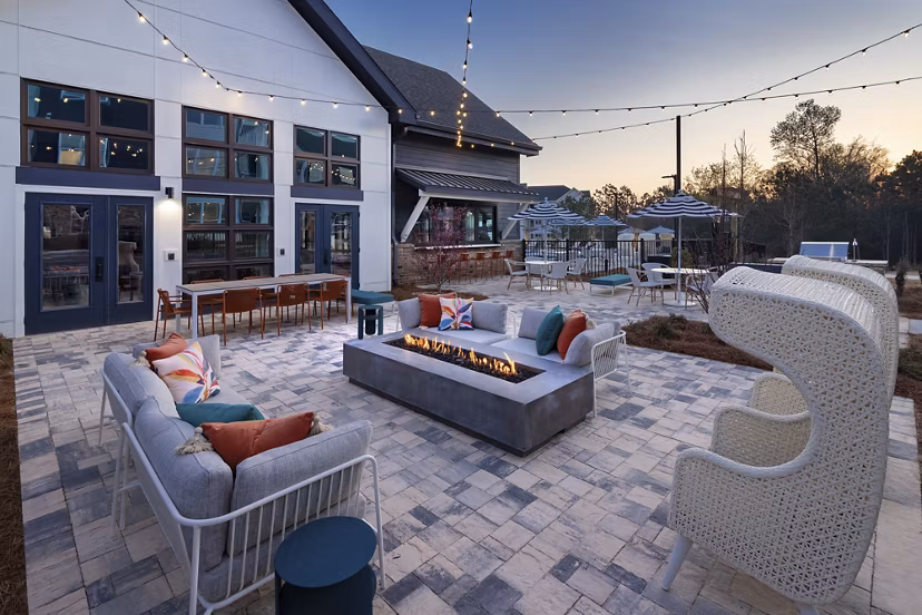Fire pit surrounded by cozy seating at Marlowe South Fulton Apartments