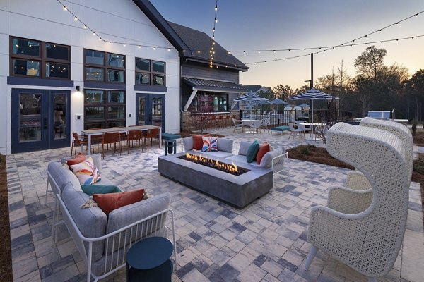 Fire pit surrounded by cozy seating at Marlowe South Fulton Apartments