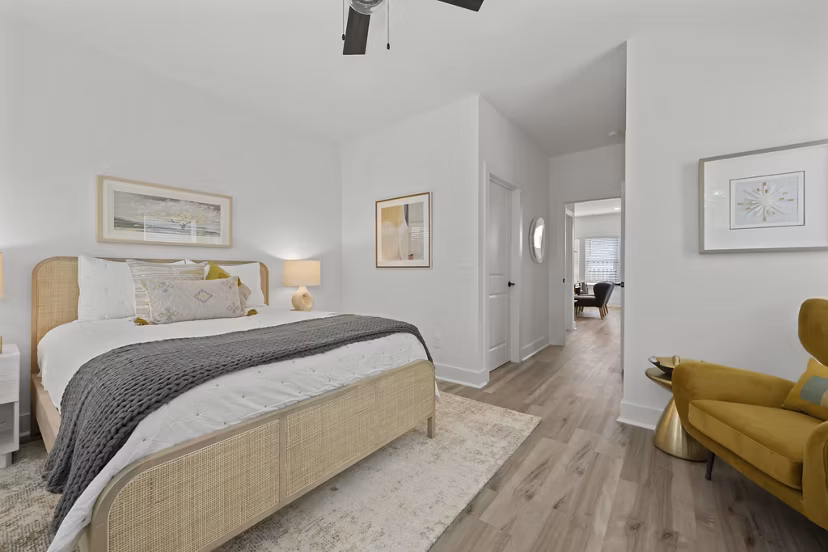 Cozy bedroom with modern furnishings at Cascadia at Highland Creek Apartments