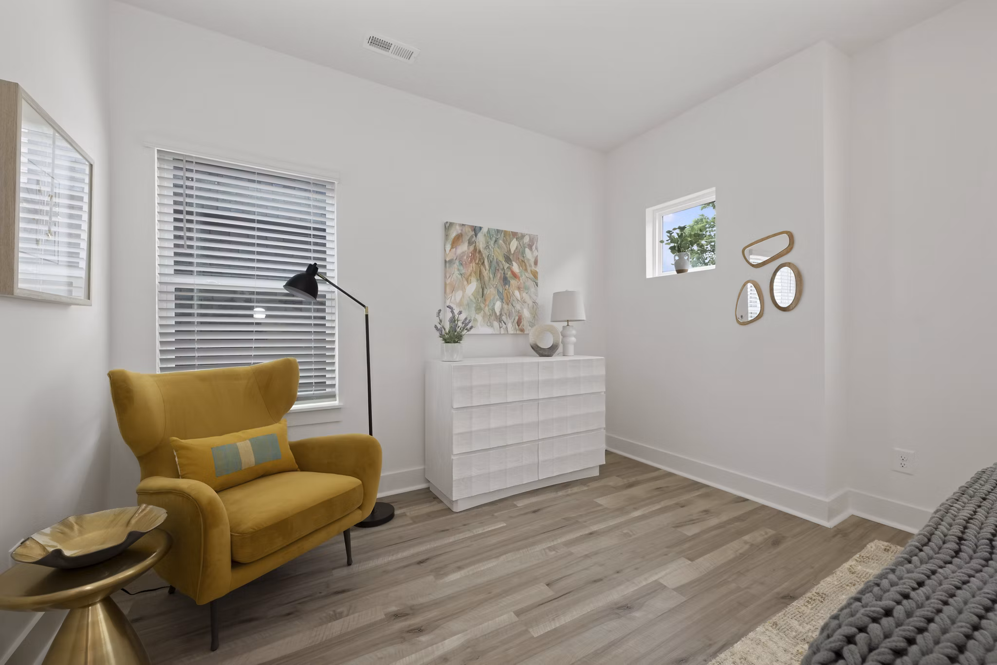 Bedroom with modern design and stylish furniture in Cascadia at Highland Creek Apartments