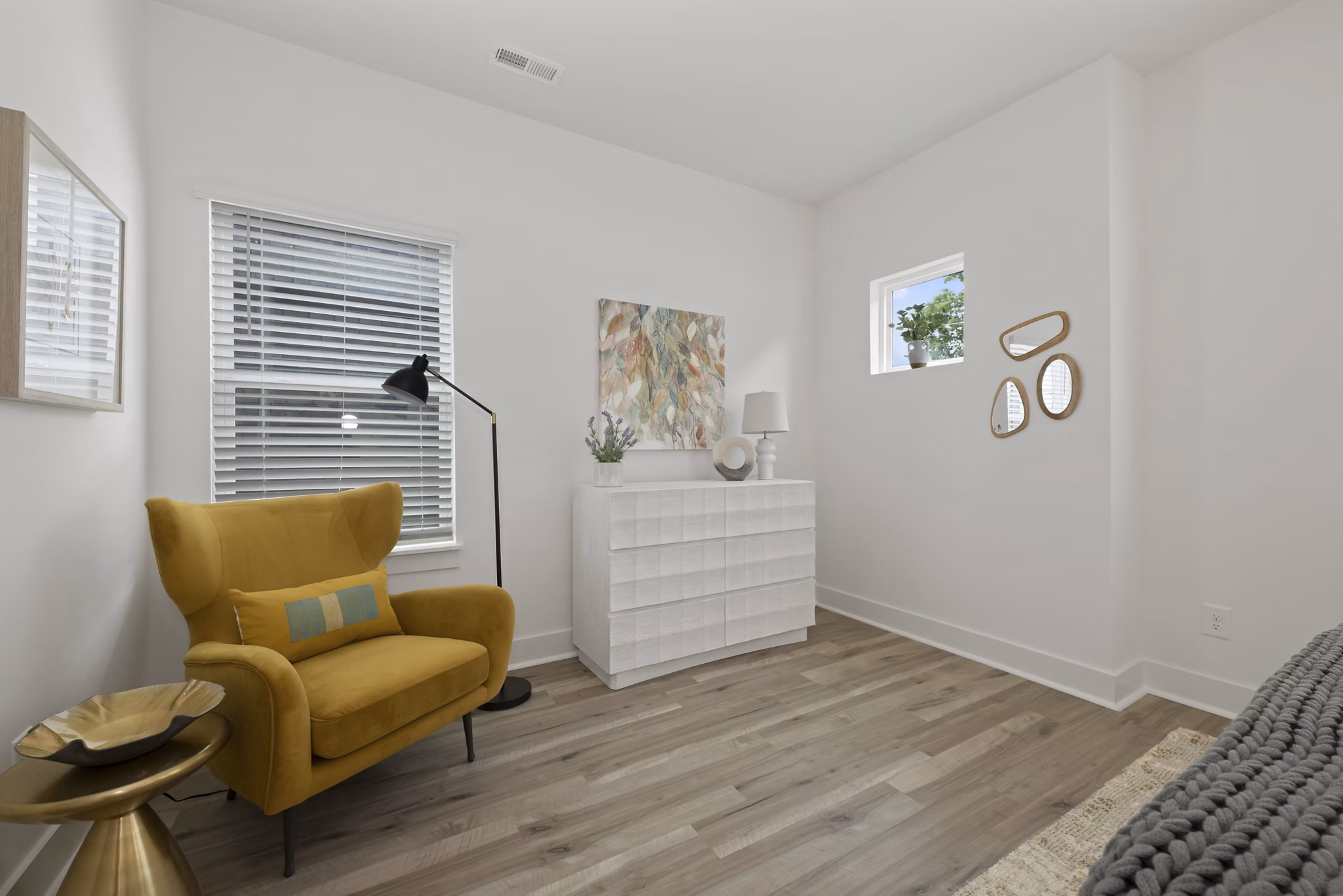 Bedroom with modern design and stylish furniture in Cascadia at Highland Creek Apartments