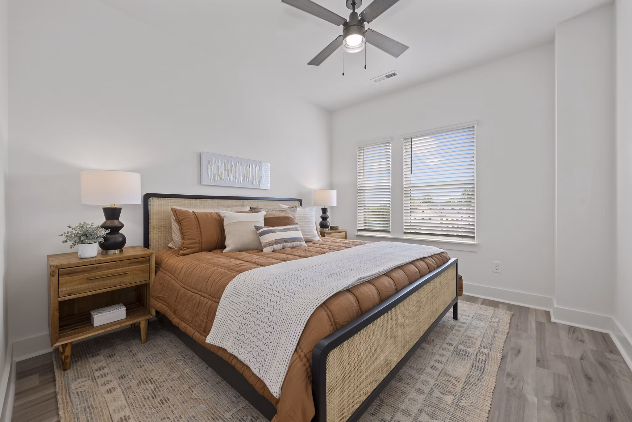 Cozy bedroom with modern furnishings at Cascadia at Highland Creek Apartments