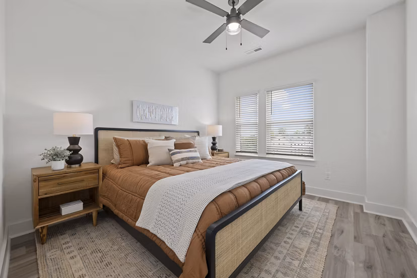 Cozy bedroom with modern furnishings at Cascadia at Highland Creek Apartments