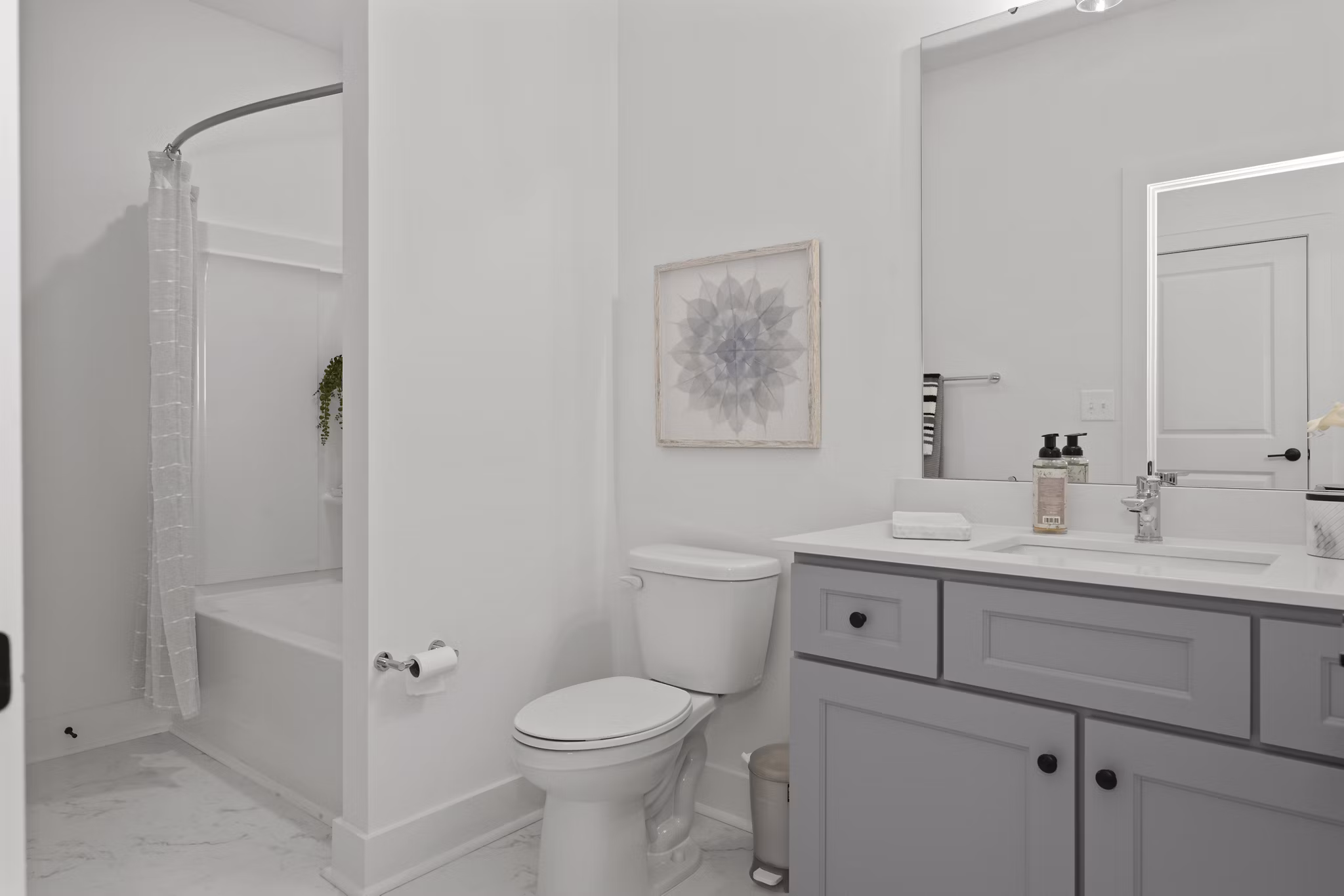 Modern bathroom with elegant fixtures at Cascadia at Highland Creek Apartments, luxury living spaces by Greystar