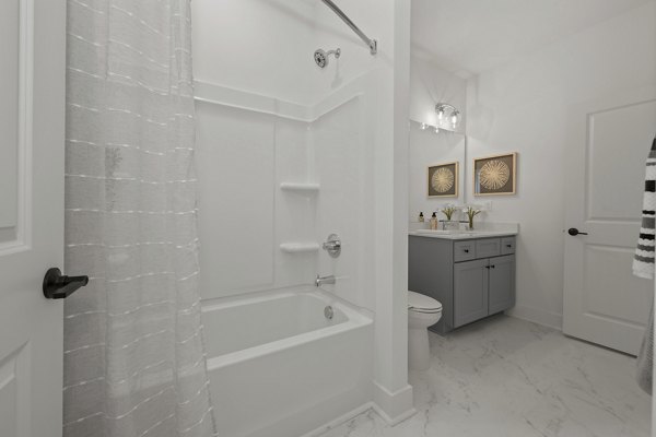 Luxurious bathroom with modern fixtures in Cascadia at Highland Creek Apartments