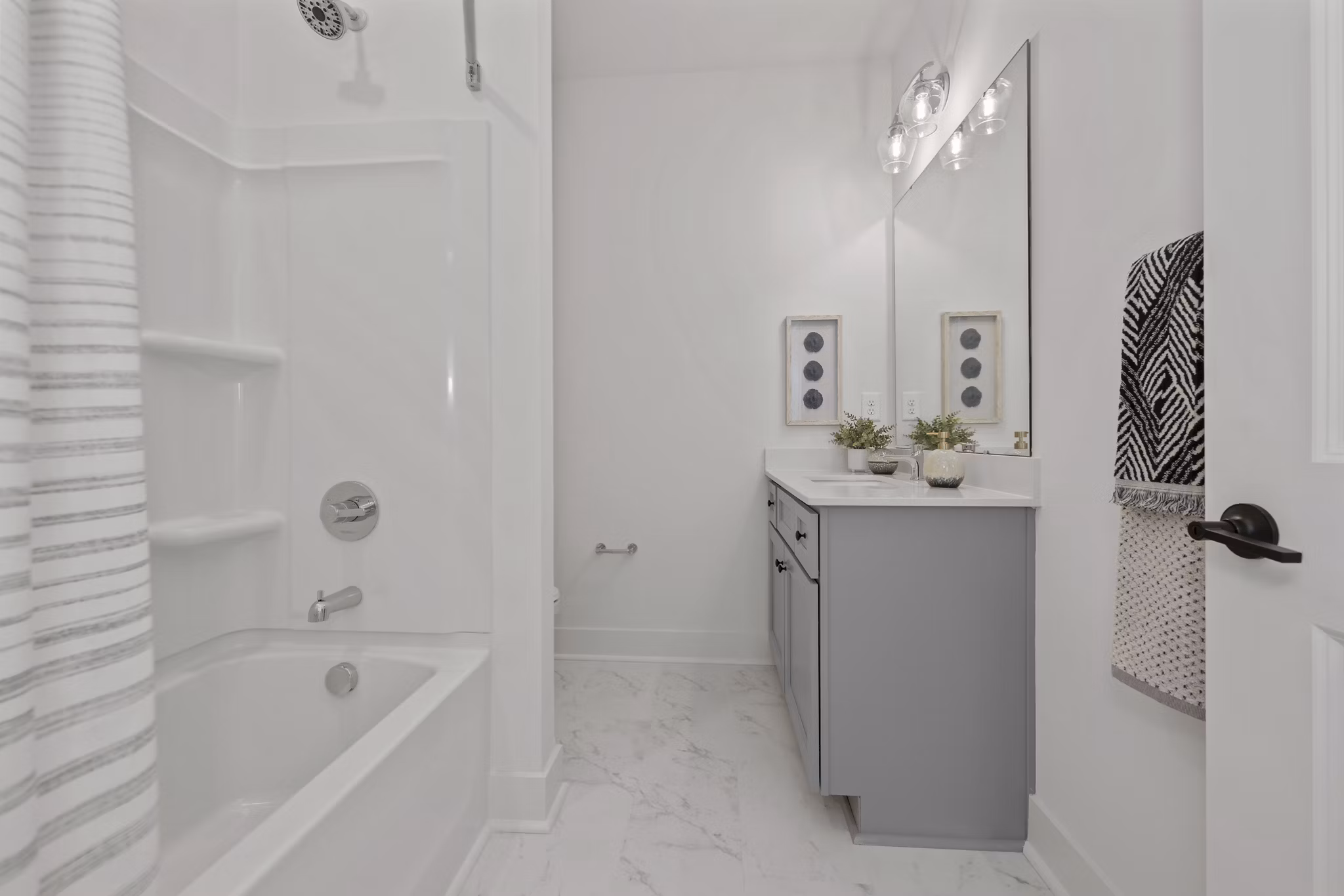 Modern bathroom with sleek fixtures at Cascadia at Highland Creek Apartments