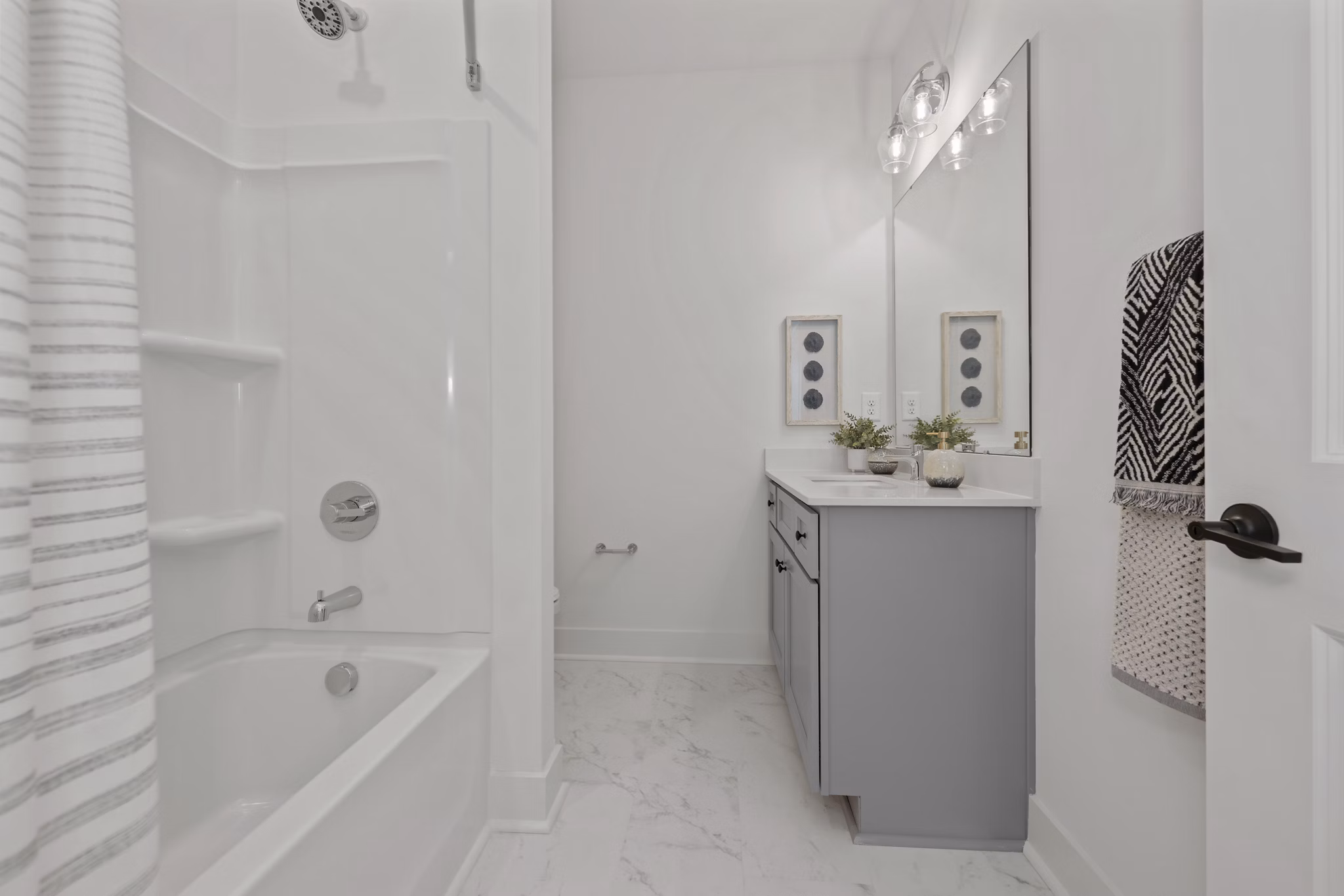 Modern bathroom with sleek fixtures at Cascadia at Highland Creek Apartments